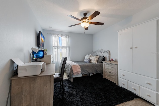 bedroom with ceiling fan, a closet, and carpet flooring