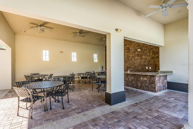 view of patio featuring ceiling fan