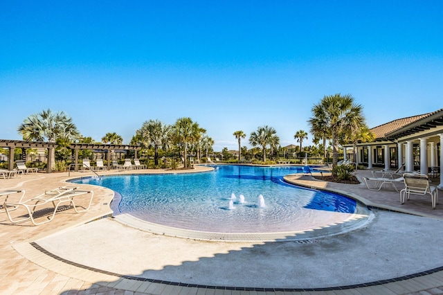 view of swimming pool featuring a pergola and a patio area