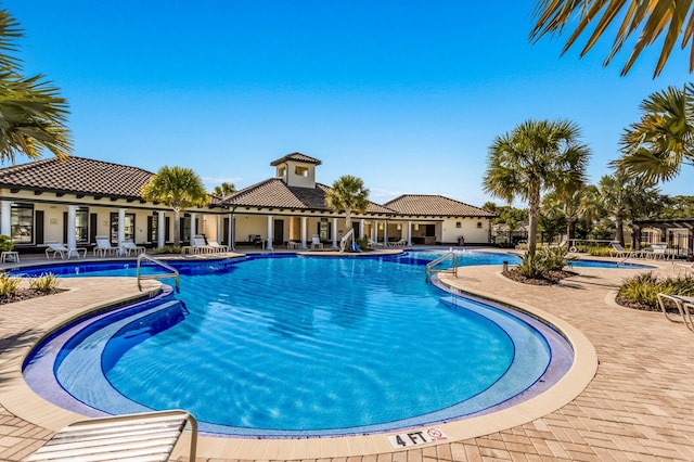 view of swimming pool with a patio