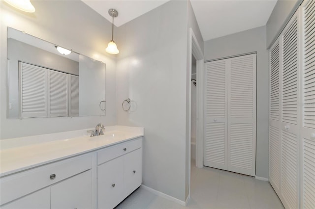 bathroom featuring tile patterned flooring and vanity