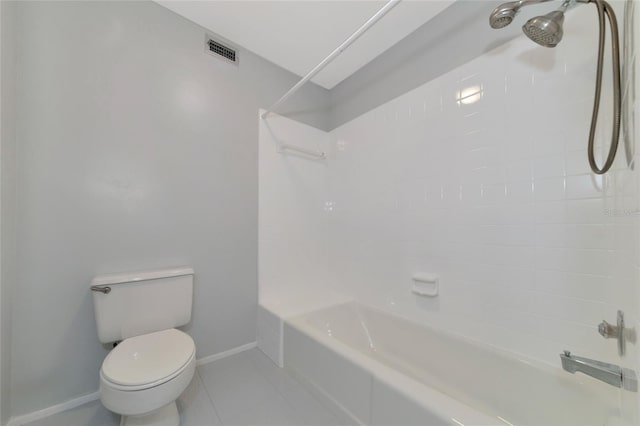 bathroom featuring tile patterned floors, toilet, and shower / bathing tub combination