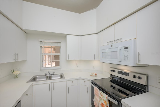 kitchen with white cabinets, sink, and stainless steel electric range