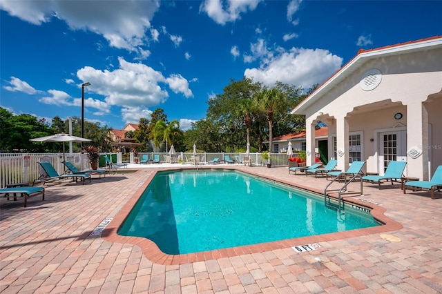 view of swimming pool featuring a patio area