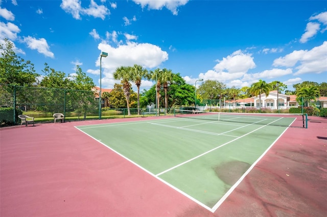 view of tennis court featuring basketball court