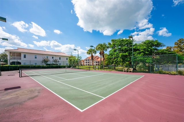 view of sport court featuring basketball hoop