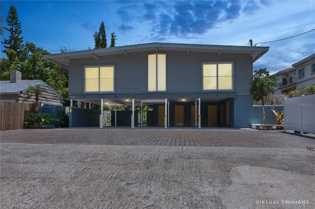 view of front of home with a carport