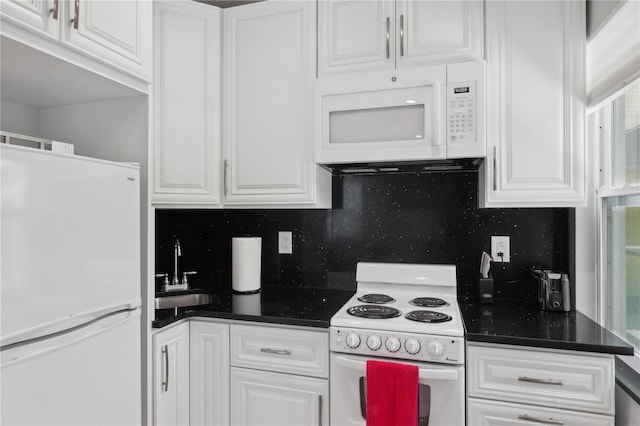 kitchen featuring white cabinets, white appliances, tasteful backsplash, and sink