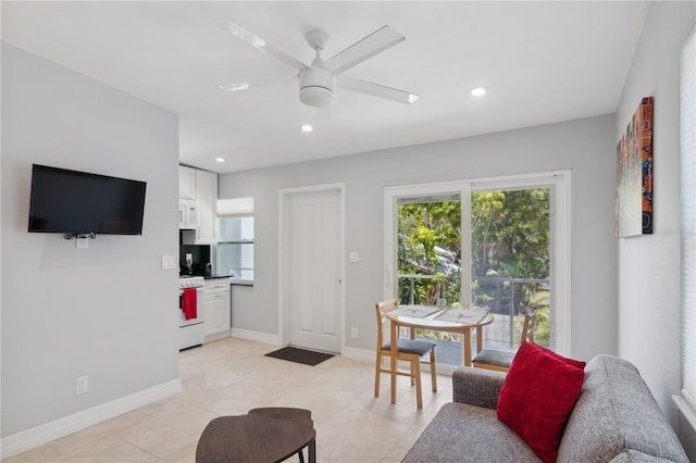 tiled living room with ceiling fan