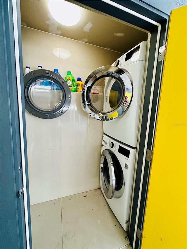 laundry room with stacked washer and dryer