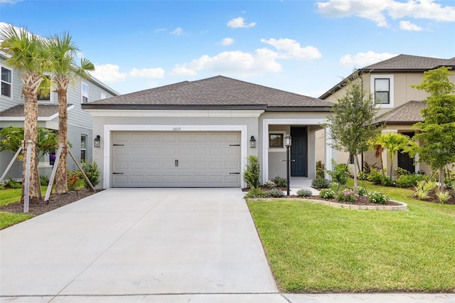 view of front of house featuring a garage and a front lawn