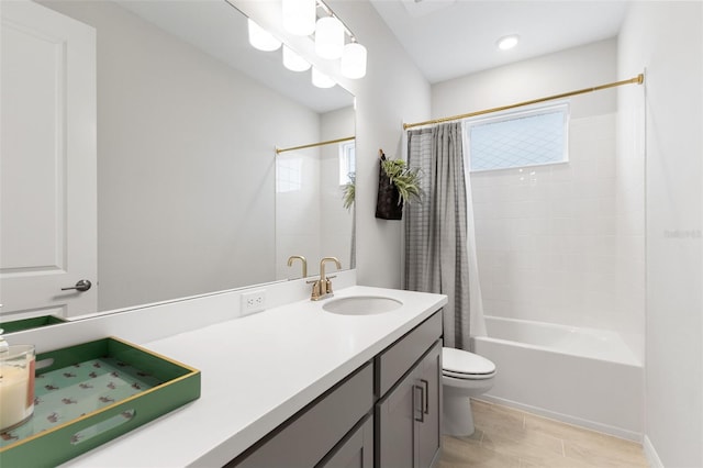 full bathroom with shower / bath combo, toilet, and vanity