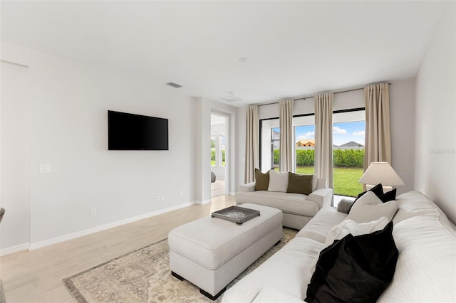 living room with light hardwood / wood-style floors