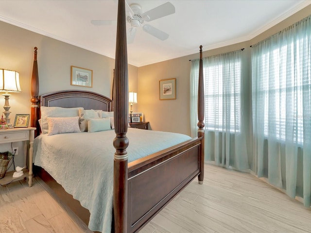 bedroom featuring ceiling fan and crown molding