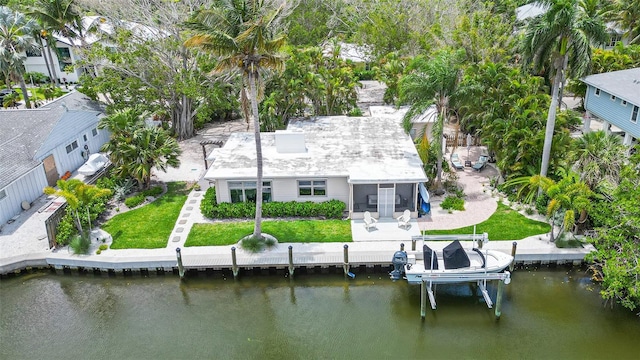 birds eye view of property featuring a water view