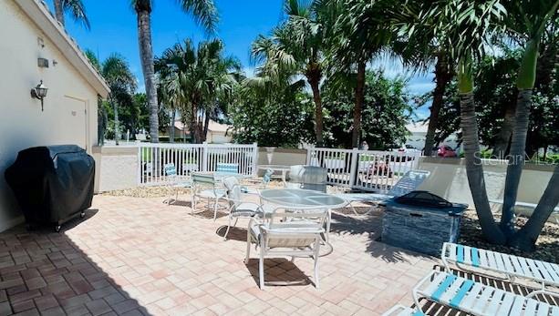 view of patio with fence and grilling area