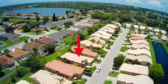 bird's eye view with a water view and a residential view