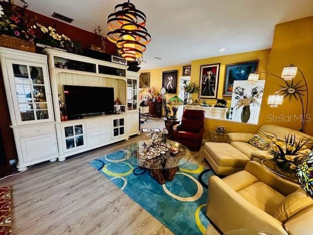 living room featuring wood finished floors and visible vents