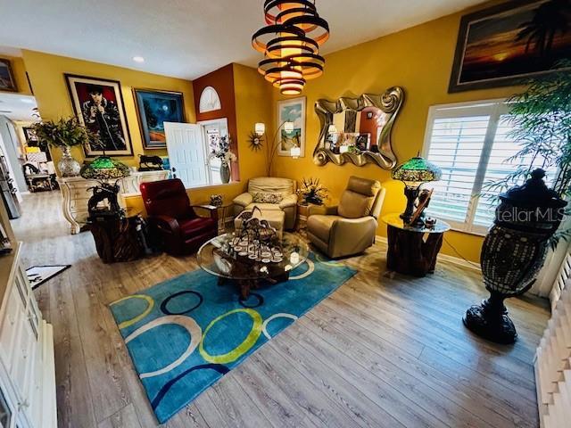 sitting room with wood finished floors and baseboards