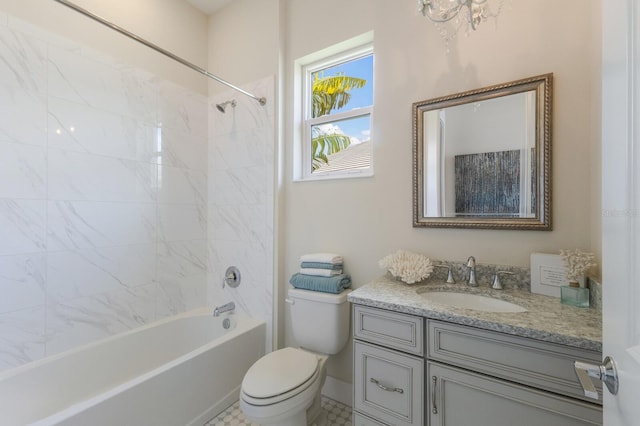 full bathroom with tile patterned flooring, toilet, vanity, and tiled shower / bath