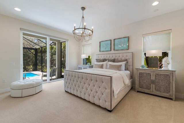 bedroom with access to exterior, carpet, and a notable chandelier