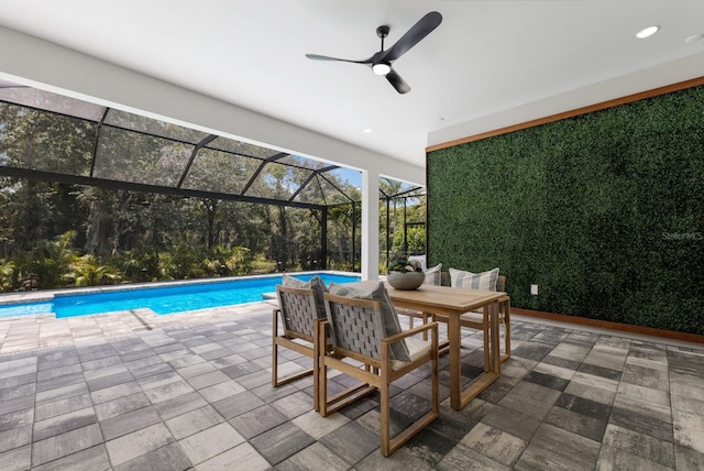 view of patio / terrace featuring ceiling fan and a lanai