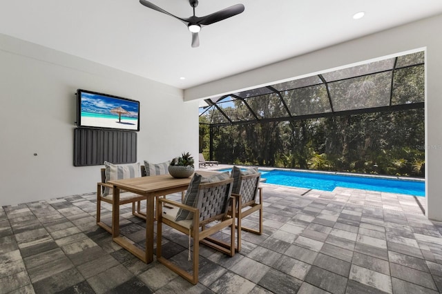 view of pool featuring a patio and glass enclosure