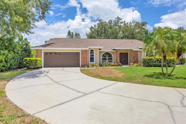 single story home featuring a garage and a front yard