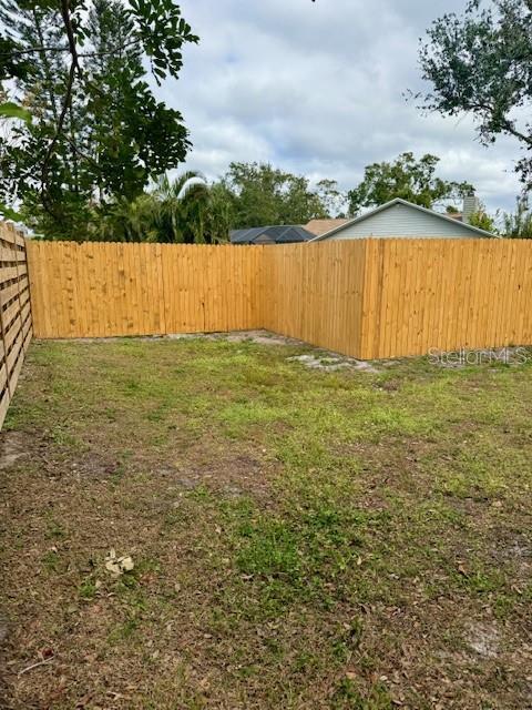 view of yard with a fenced backyard