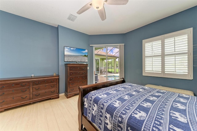 bedroom featuring access to exterior, ceiling fan, and wood-type flooring