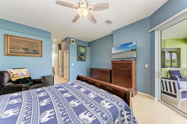 bedroom with light hardwood / wood-style floors and ceiling fan