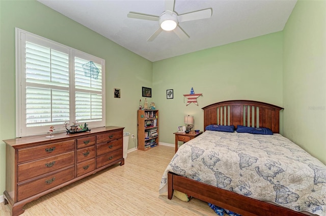 bedroom featuring light wood-type flooring and ceiling fan