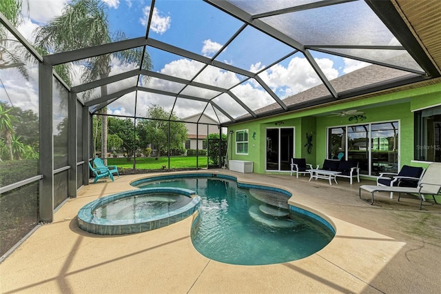 view of pool featuring an in ground hot tub, a patio, ceiling fan, and a lanai