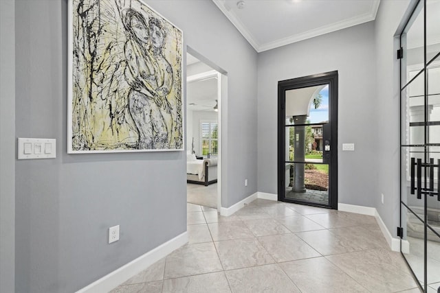 entryway featuring ceiling fan, plenty of natural light, and ornamental molding