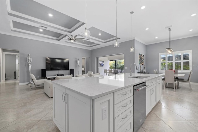 kitchen with a center island with sink, crown molding, sink, hanging light fixtures, and ceiling fan