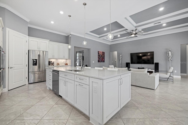 kitchen with a kitchen island with sink, coffered ceiling, white cabinets, sink, and stainless steel appliances