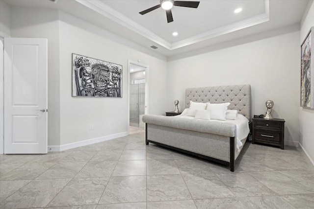 bedroom featuring ceiling fan, a raised ceiling, ornamental molding, and ensuite bath