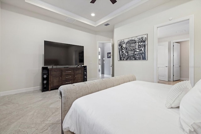 bedroom featuring a tray ceiling, ceiling fan, and ornamental molding