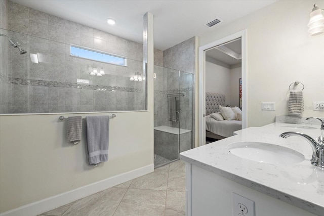 bathroom featuring tile patterned floors, vanity, and an enclosed shower