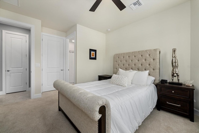 bedroom featuring ceiling fan and light colored carpet