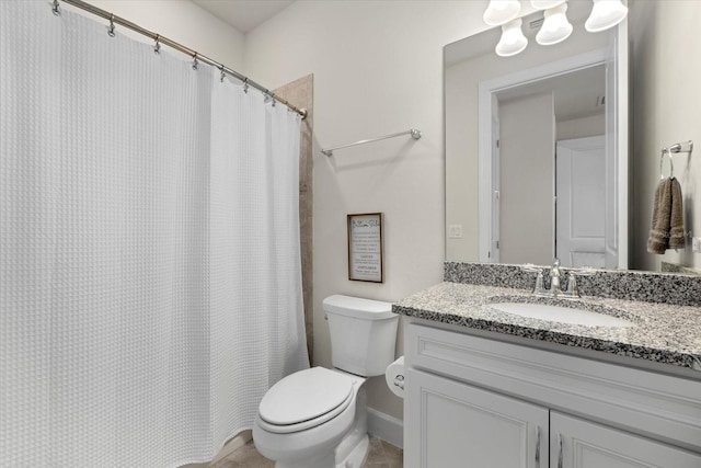 bathroom with curtained shower, vanity, and toilet