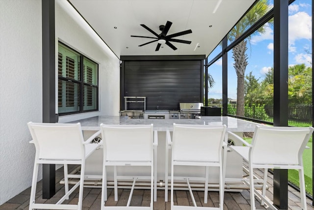 sunroom with ceiling fan