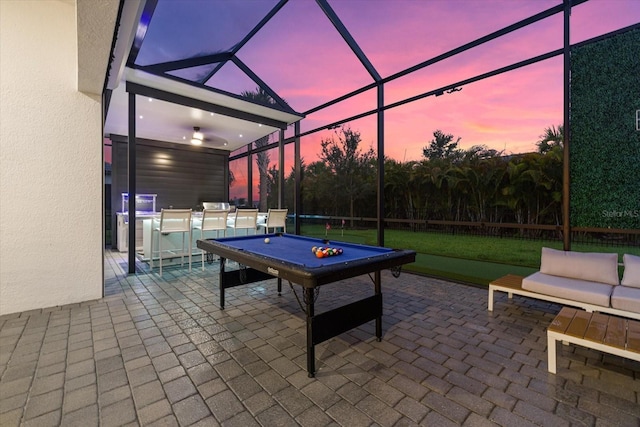 patio terrace at dusk with a lanai