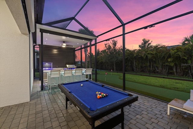 patio terrace at dusk with glass enclosure