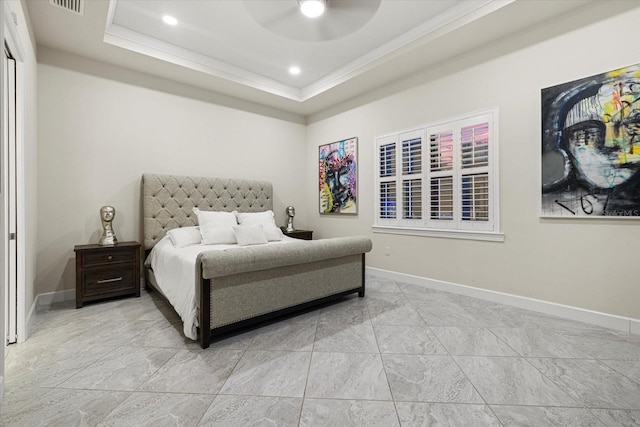 bedroom featuring a tray ceiling, ceiling fan, and crown molding