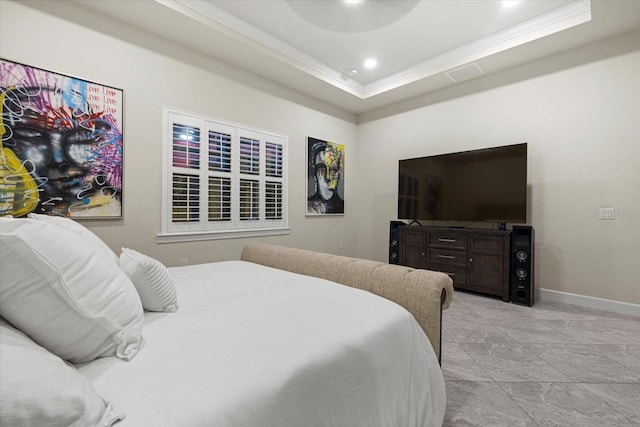 bedroom featuring a tray ceiling and ornamental molding