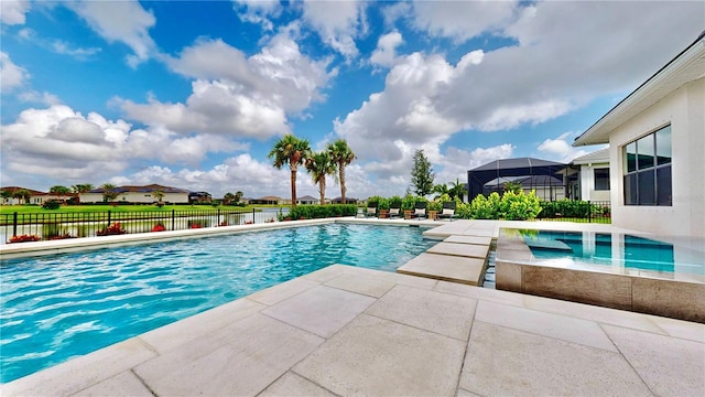 view of swimming pool with a lanai