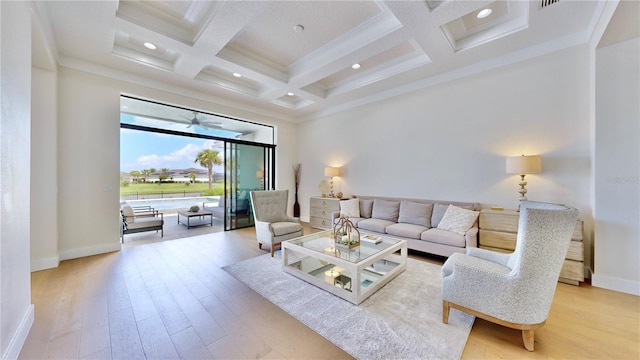 living room with coffered ceiling, crown molding, ceiling fan, light hardwood / wood-style floors, and beam ceiling