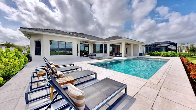 view of swimming pool with a patio area and ceiling fan