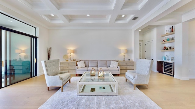 living room featuring beamed ceiling, crown molding, coffered ceiling, and bar area